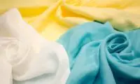 Close-up view of sustainable, environmentally friendly textile fabric, showcasing the texture and natural color of eco-conscious material.